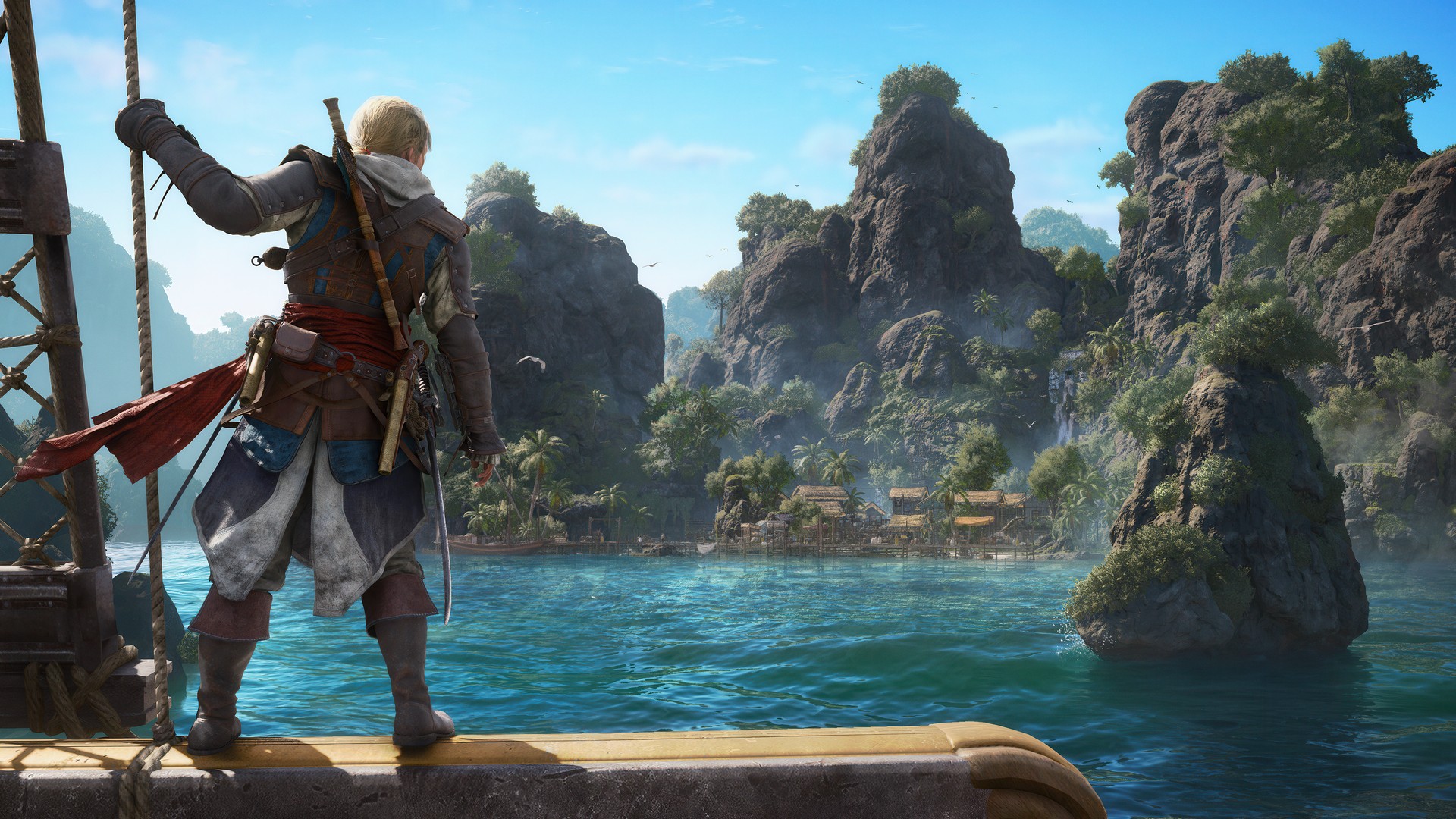Edward Kenway stands on the edge of the Jackdaw, holding a rope, as he looks out across the water in Assassin's Creed Black Flag Resynced