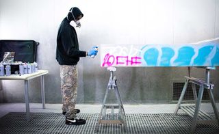 Portrait of Virgil Abloh working on graffiti for the Efflorescence furniture collection for Galerie Kreo in Paris