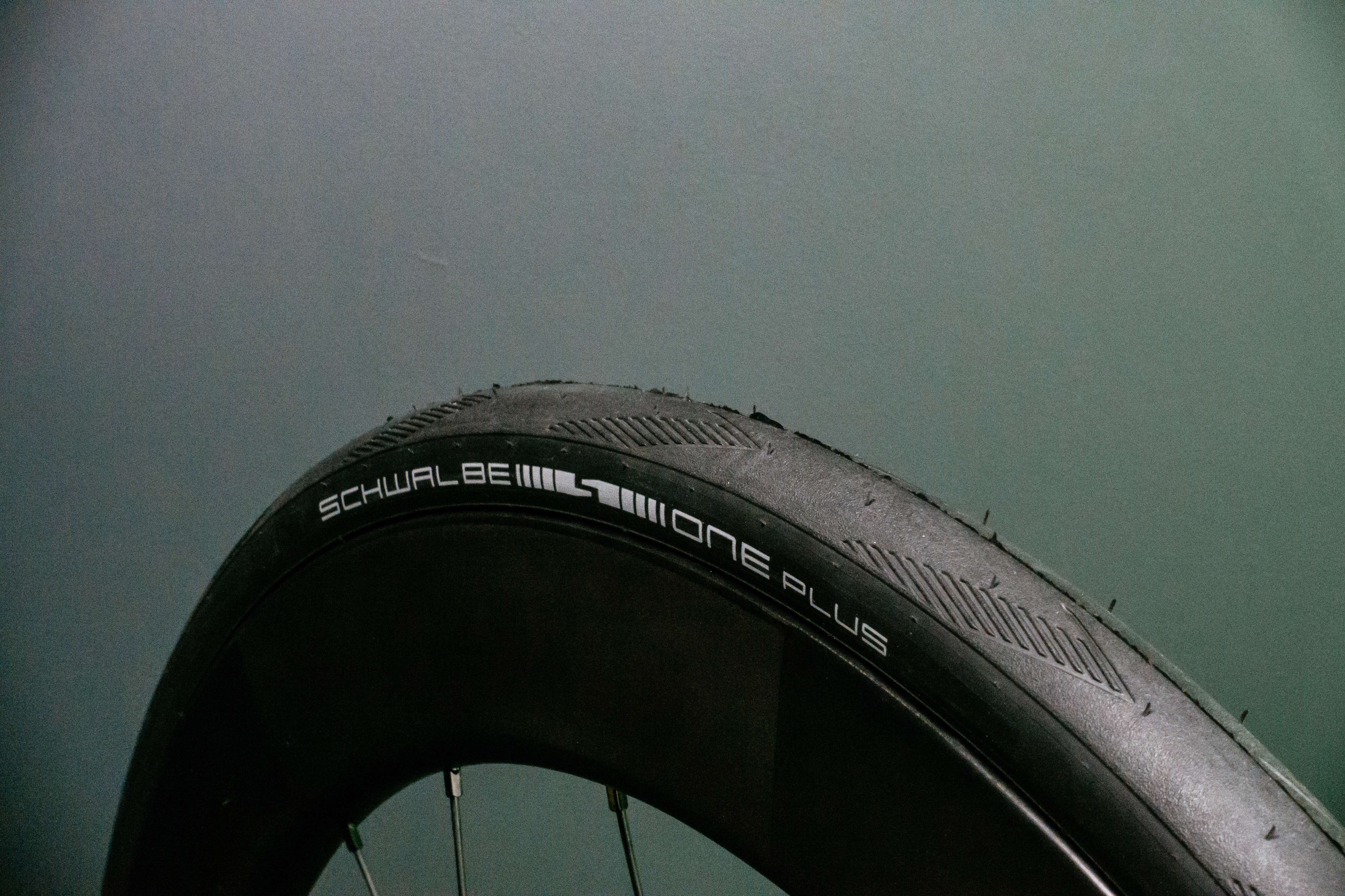 Schwalbe One Plus Road tyre with a green background