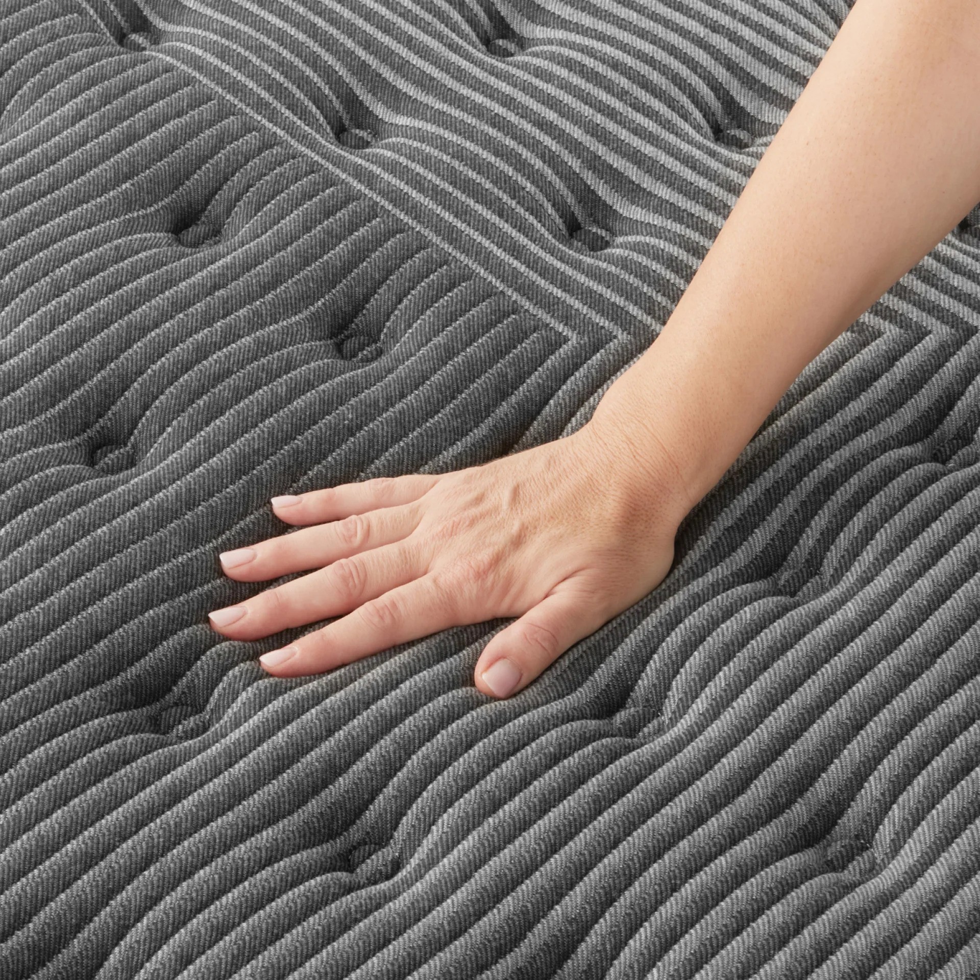 A close up image of the surface of a Beautyrest Black mattress