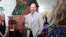 Prince William jokes with members of the community during his visit to mental health charity Norfolk and Waveney Mind on June 11, 2026