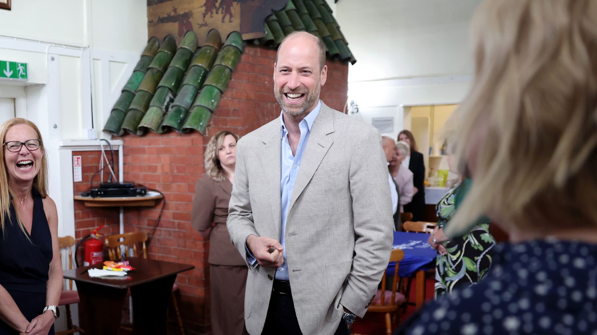 Prince William jokes with members of the community during his visit to mental health charity Norfolk and Waveney Mind on June 11, 2026