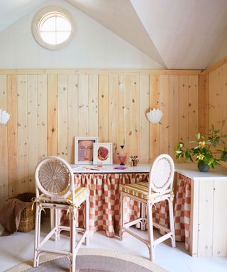 pool house skirted counter with bar stools and pine clad walls