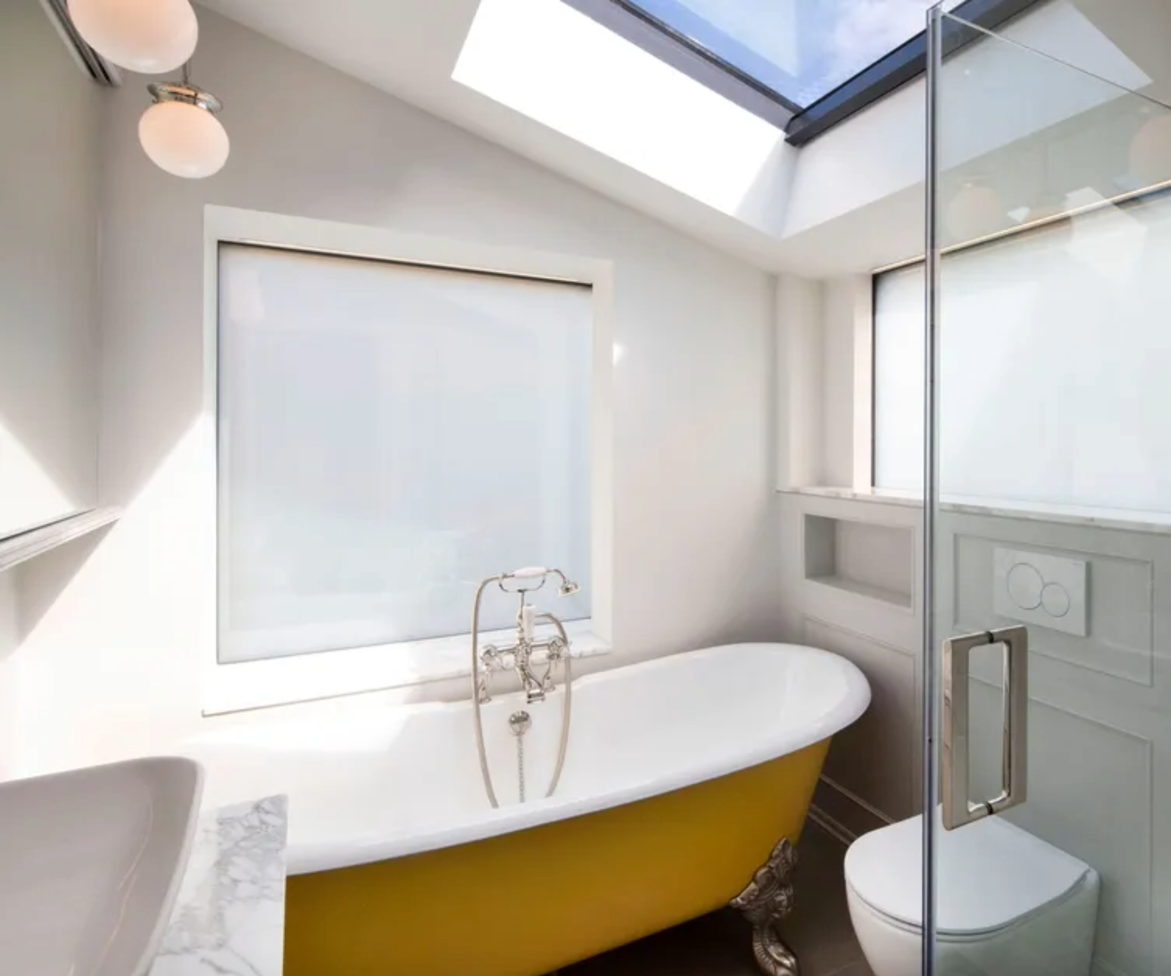Bathroom with switchable glass window idea
