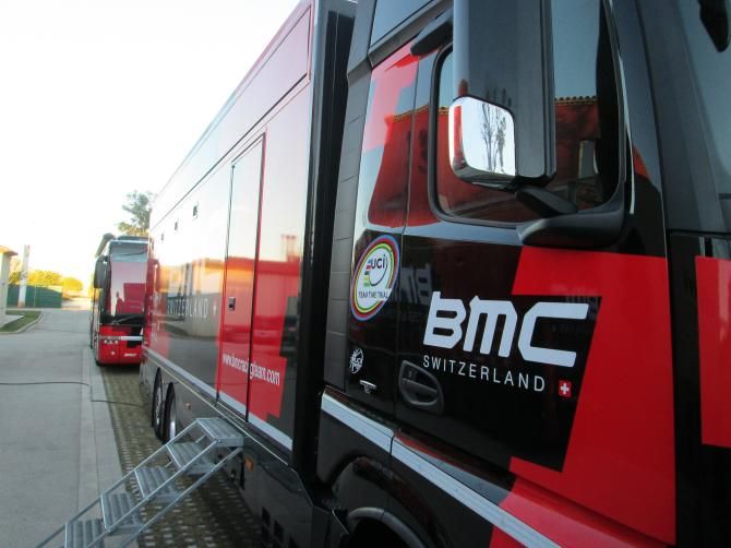 The team busses embossed with the logo of World Champion in the TTT