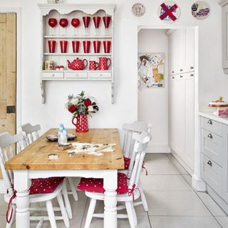kitchen with white wall and dining table