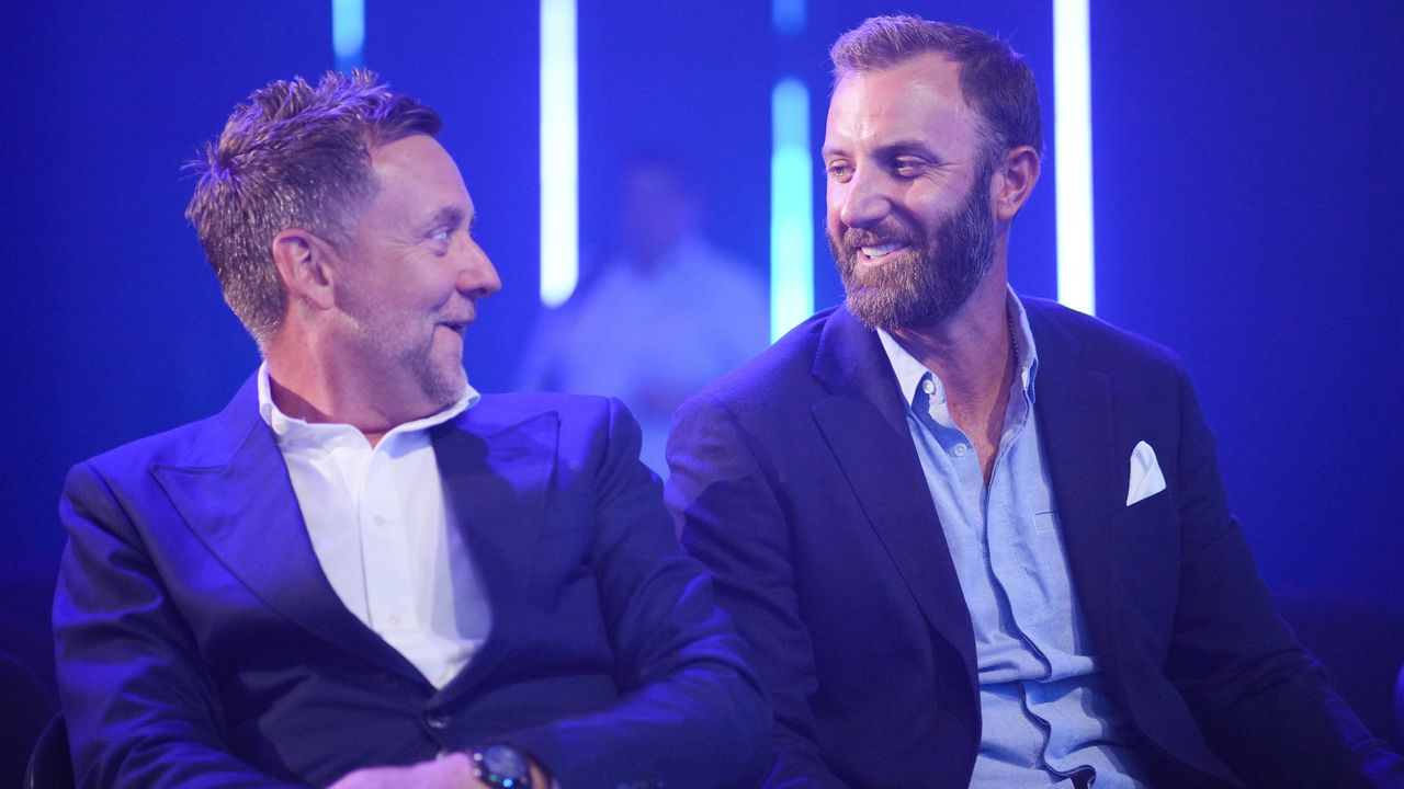 Ian Poulter and Dustin Johnson smile at each other