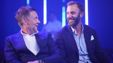 Ian Poulter and Dustin Johnson smile at each other