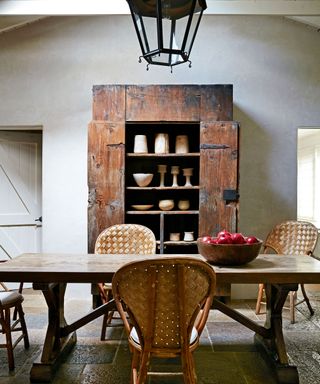dining room with polished plaster walls and antique and vintage furniture