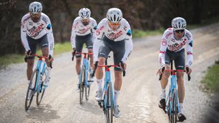 AG2R Citroen team members in denim cycling shorts on Tuscan white roads