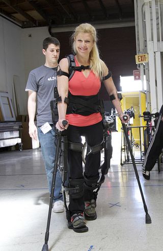 Photo of an Ekso Bionics employee wearing the robotic suit