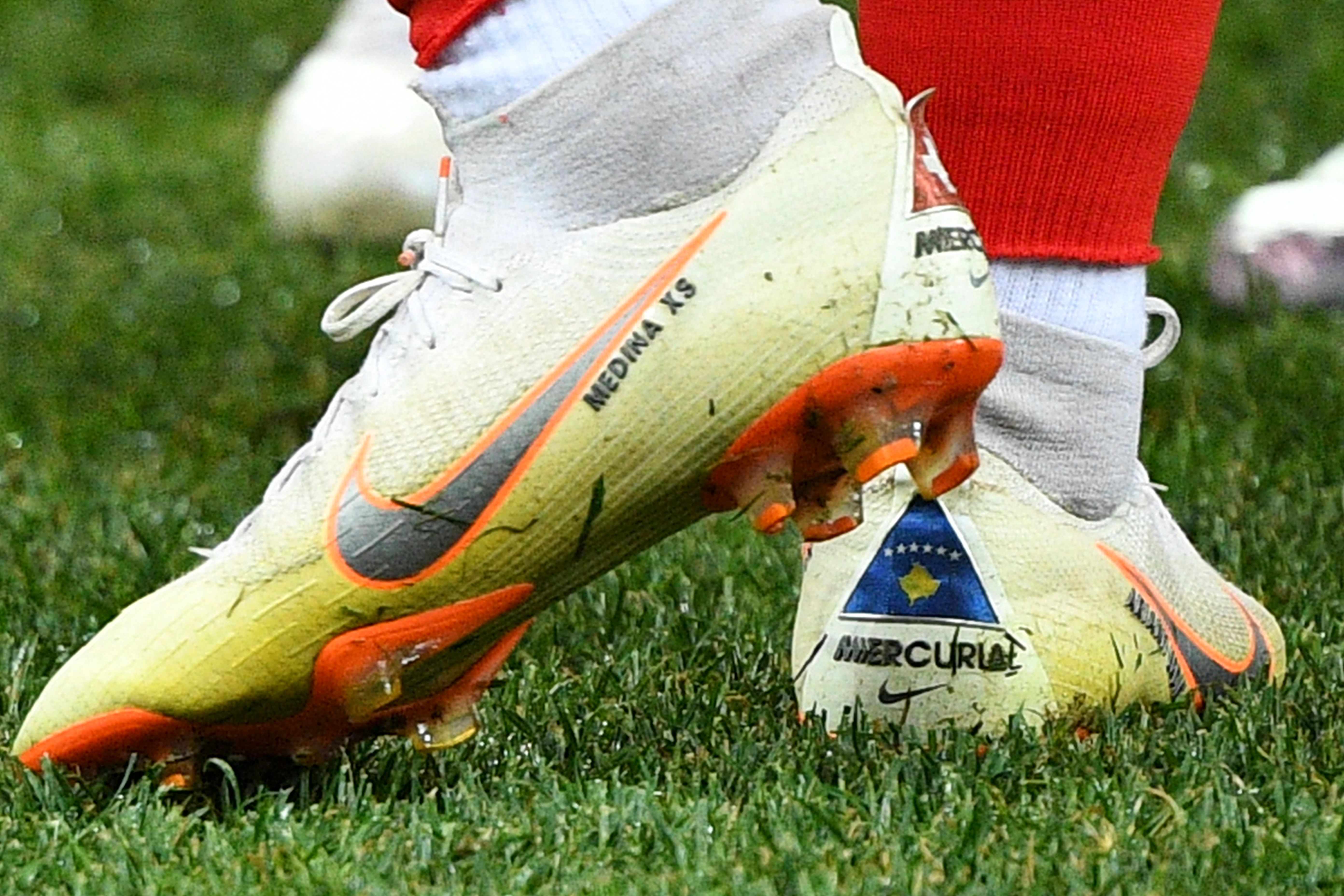 A picture shows the Switzerland and the Kosovo flag on the shoes of Switzerland&amp;amp;apos;s forward Xherdan Shaqiri prior to the Russia 2018 World Cup Group E football match between Switzerland and Costa Rica at the Nizhny Novgorod Stadium in Nizhny Novgorod on June 27, 2018. (Photo by Johannes EISELE / AFP) / RESTRICTED TO EDITORIAL USE - NO MOBILE PUSH ALERTS/DOWNLOADS (Photo credit should read JOHANNES EISELE/AFP via Getty Images)