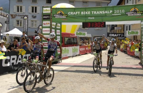 Team Full Dynamix and Team Bulls sprint at the end of stage 6 of the TransAlp