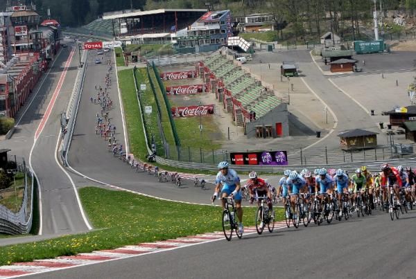 The Giro peloton rides on the legendary Spa Francochamps circuit, home of the Formula One Belgian Grand Prix.