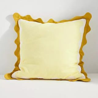 anthropologie yellow ruffle cushion