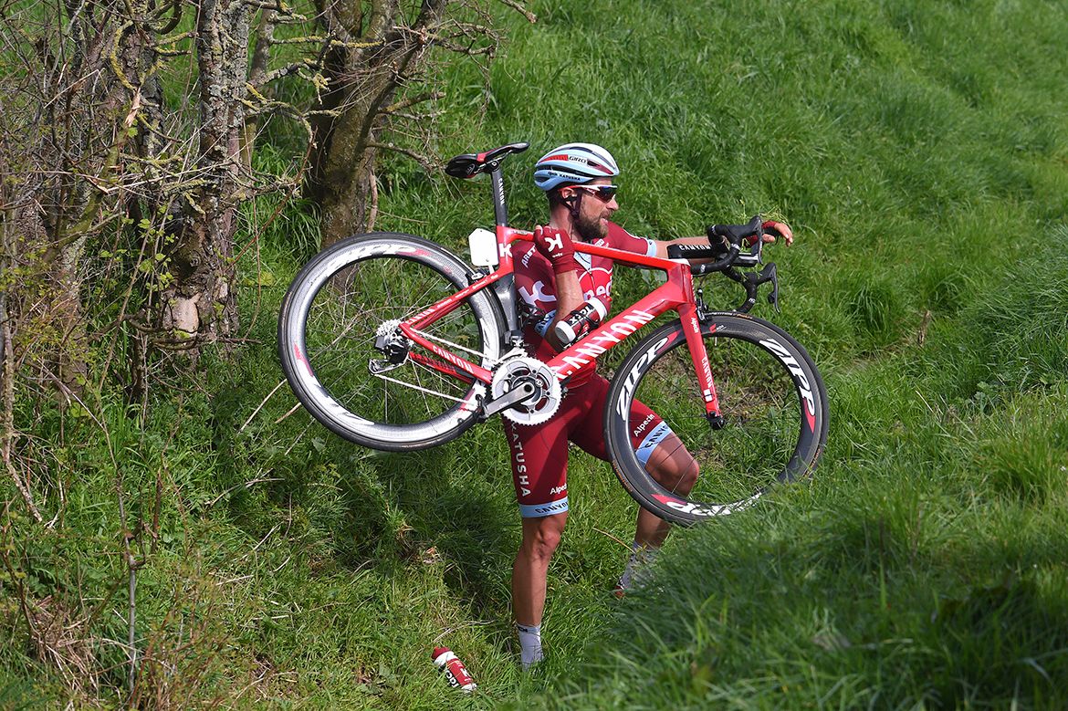 Marco Haller making his way back onto the road after a crash sent him far afield at Gent-Wevelgem