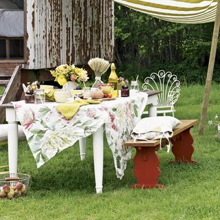 outdoor dining table with rustic floral linens tablecloths striped canopy and opt for chunky crockery for bohemian flourish