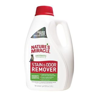 A white plastic bottle of Nature's Miracle Stain and Odor Remover Cat with a red cap and red text