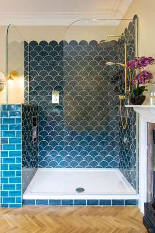 A vibrant bathroom design with blue tiles