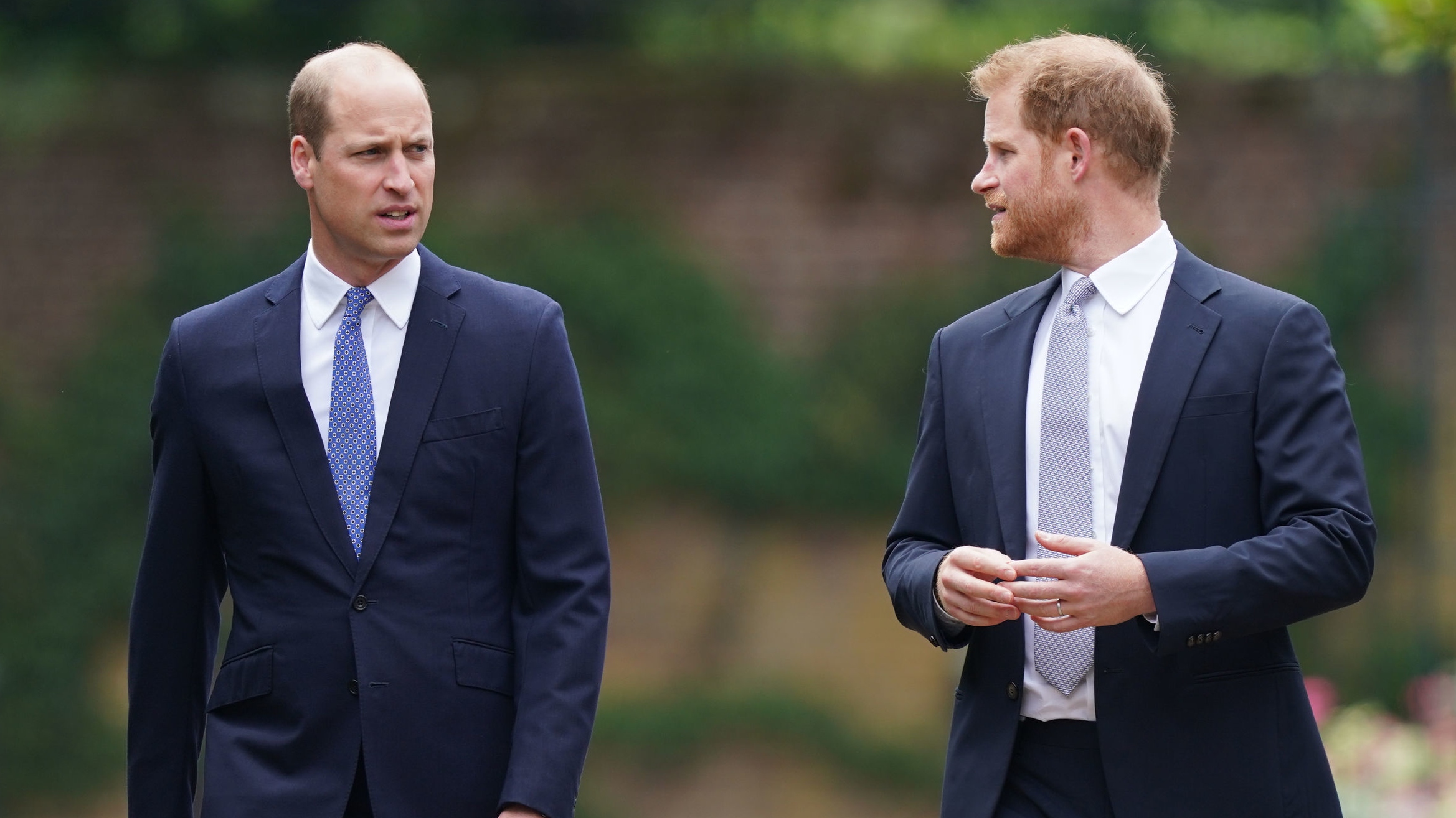 Prince William and Prince Harry arrive for the unveiling of a statue they commissioned of their mother Diana, Princess of Wales, in the Sunken Garden at Kensington Palace
