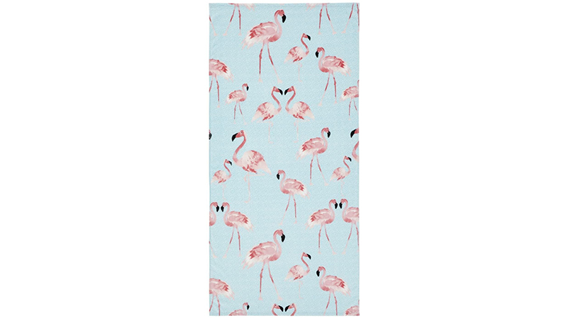 Beach towel with motif of pink flamingoes on blue and white background