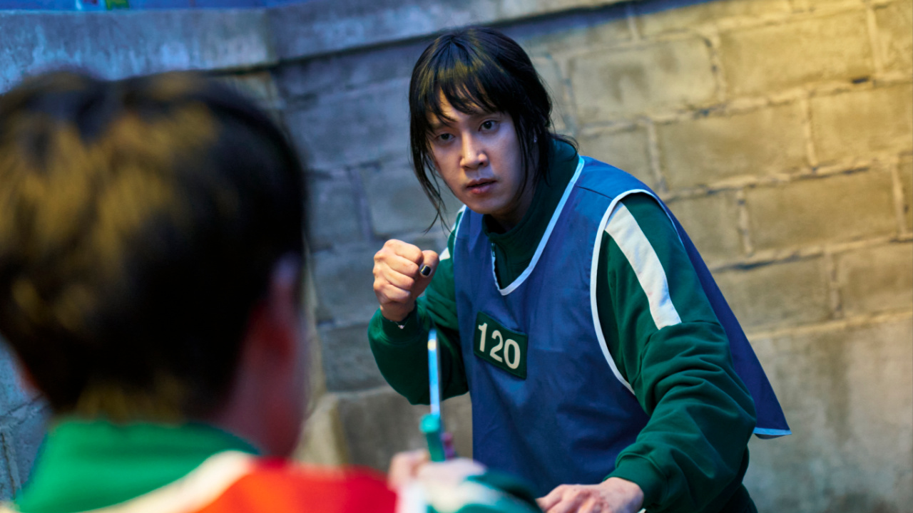 Player 120 in Squid Game Season 3 holding a knife.