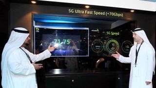 A screen showing super-fast 5G internet speeds at a tech expo