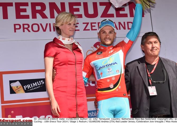 Andrea Guardini wears the leader's jersey after winning the opening stage