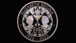 The reverse of a five pound commemorative crown piece coin featuring two portraits of Queen Elizabeth II idisplayed during the unveiling of the design of King Charles IIIs first coins by the Royal Mint in London, UK, on Thursday, Sept. 29, 2022.