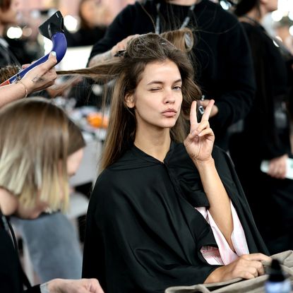 Barbara Palvin prepares backstage at the Victoria's Secret Fashion Show 2025 with hair blow dry