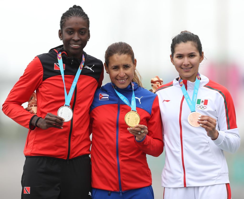 From L to R Trinidad and Tobagos Teniel Campbell Cubas Arlenis Sierra and Mexicos Ariadna Gutierrez stand at the podium after winning the silver gold and bronze medals respectively in the Cycling Road Race Womens Finals at the Lima 2019 PanAmerican Games in Lima on August 10 2019 Photo by LUKA GONZALES AFP Photo credit should read LUKA GONZALESAFP via Getty Images