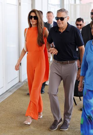 Amal Clooney departs the 81st Venice Film Festival with husband George Clooney.