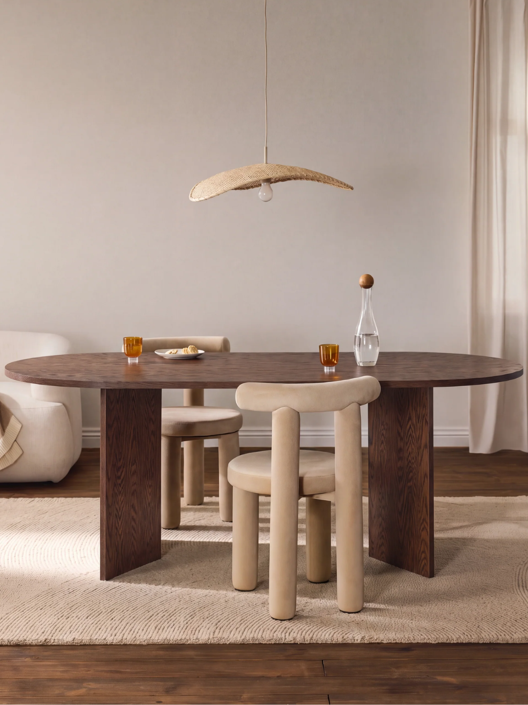 An oval wood dining table from Westwing