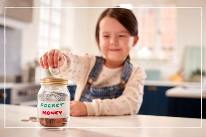young girl putting coins into a jar labelled pocket money