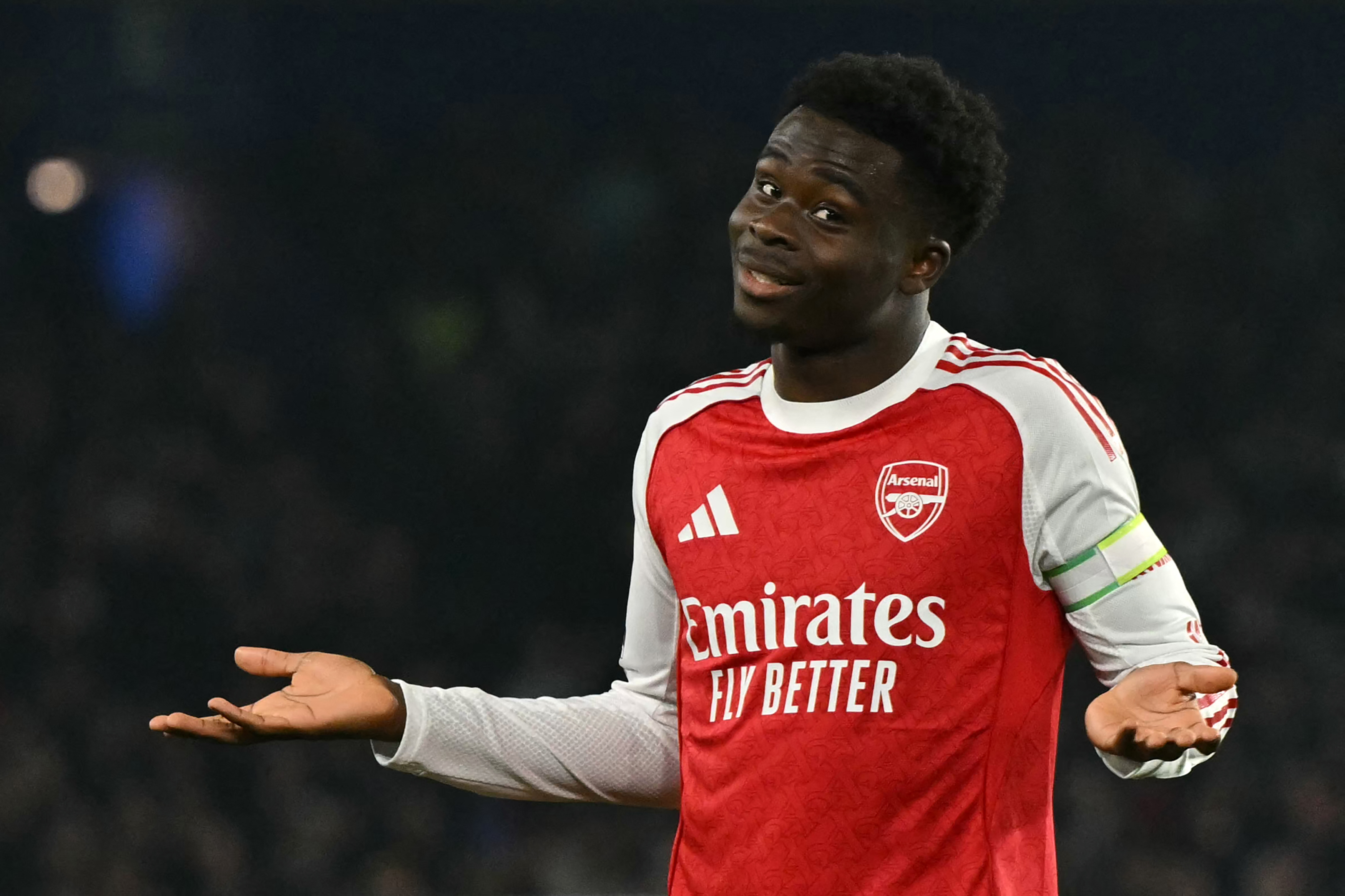 Arsenal's English midfielder #07 Bukayo Saka celebrates after scoring the opening goal of the English Premier League football match between Brighton and Hove Albion and Arsenal at the American Express Community Stadium in Brighton, southern England on March 4, 2026. 