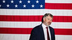 Thomas Massie in front of an American flag