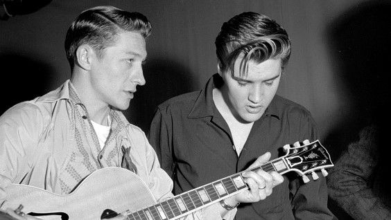 Elvis Presley and Scotty Moore rehearse for their appearance on the Milton Berle Show at the NBC Burbank studios on June 4 1956 in Los Angeles California