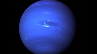 An image of Neptune captured by Voyager 2 in 1989. New infrared images of the planet has revealed some surprising temperatures in its atmosphere.