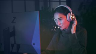 a photo of a woman using the Beoplay Portal PC PS headphones 