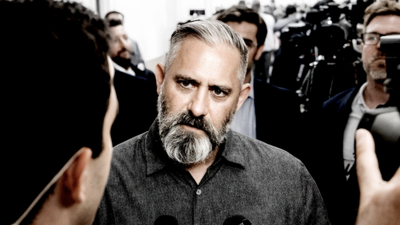 Jeremy Corbell faces the press in "Sleeping Dog" his new UFO/UAP documentary filmed in secret