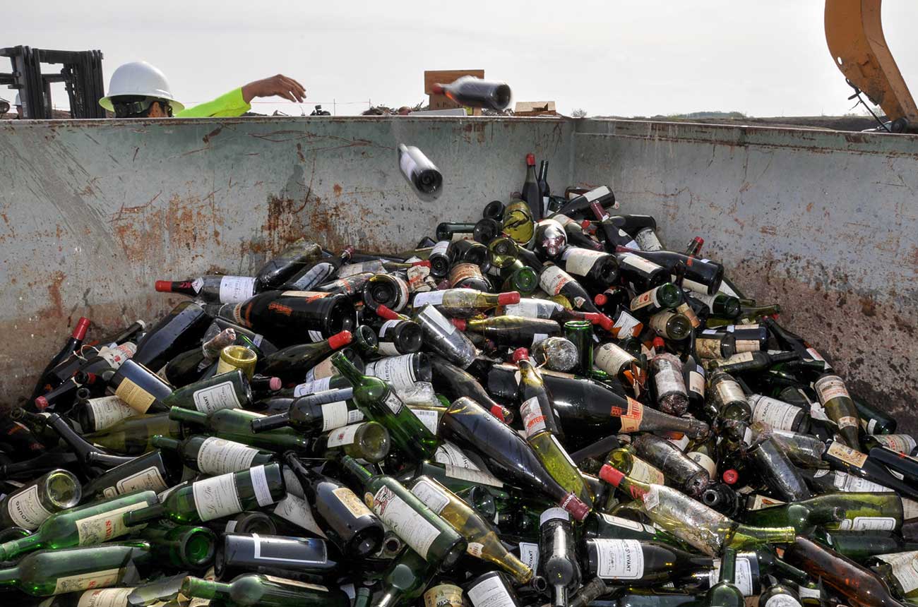 Counterfeit wines once belonging to Rudy Kurniawan being destroyed in Texas in 2015.