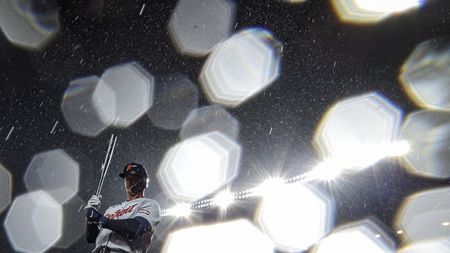 MAY 22: Dillon Dingler #13 of the Detroit Tigers stands on deck in the rain before batting against the Baltimore Orioles at Oriole Park at Camden Yards on May 22, 2026 in Baltimore, Maryland. 