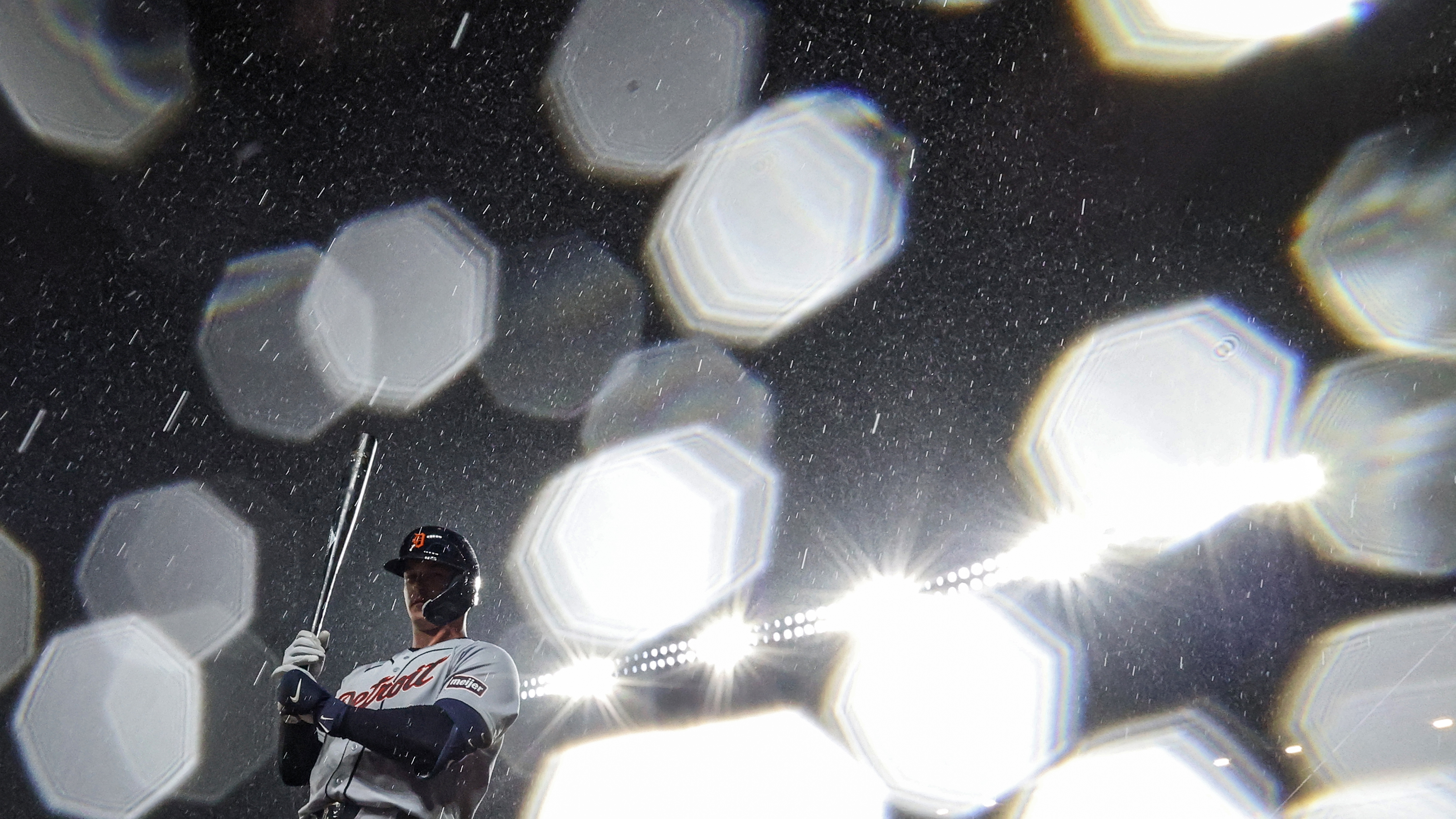 MAY 22: Dillon Dingler #13 of the Detroit Tigers stands on deck in the rain before batting against the Baltimore Orioles at Oriole Park at Camden Yards on May 22, 2026 in Baltimore, Maryland. 