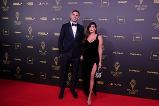 Argentina's goalkeeper Emiliano Martinez (L) and his wife Amanda "Mandinha" Martinez pose prior to the 2023 Ballon d'Or France Football award ceremony at the Theatre du Chatelet in Paris on October 30, 2023..