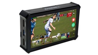 The all-in-one Director Mini showing soccer on its small screen. 