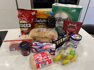 Rachel's Aldi food shop including cereal, ice cream and toilet rolls, displayed on a kitchen counter