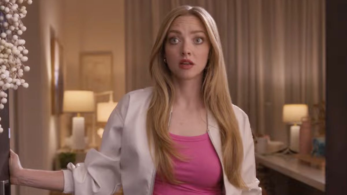 Amanda Seyfried as Karen Smith opening the door to Gretchen Wieners in the Walmart Black Friday ad.