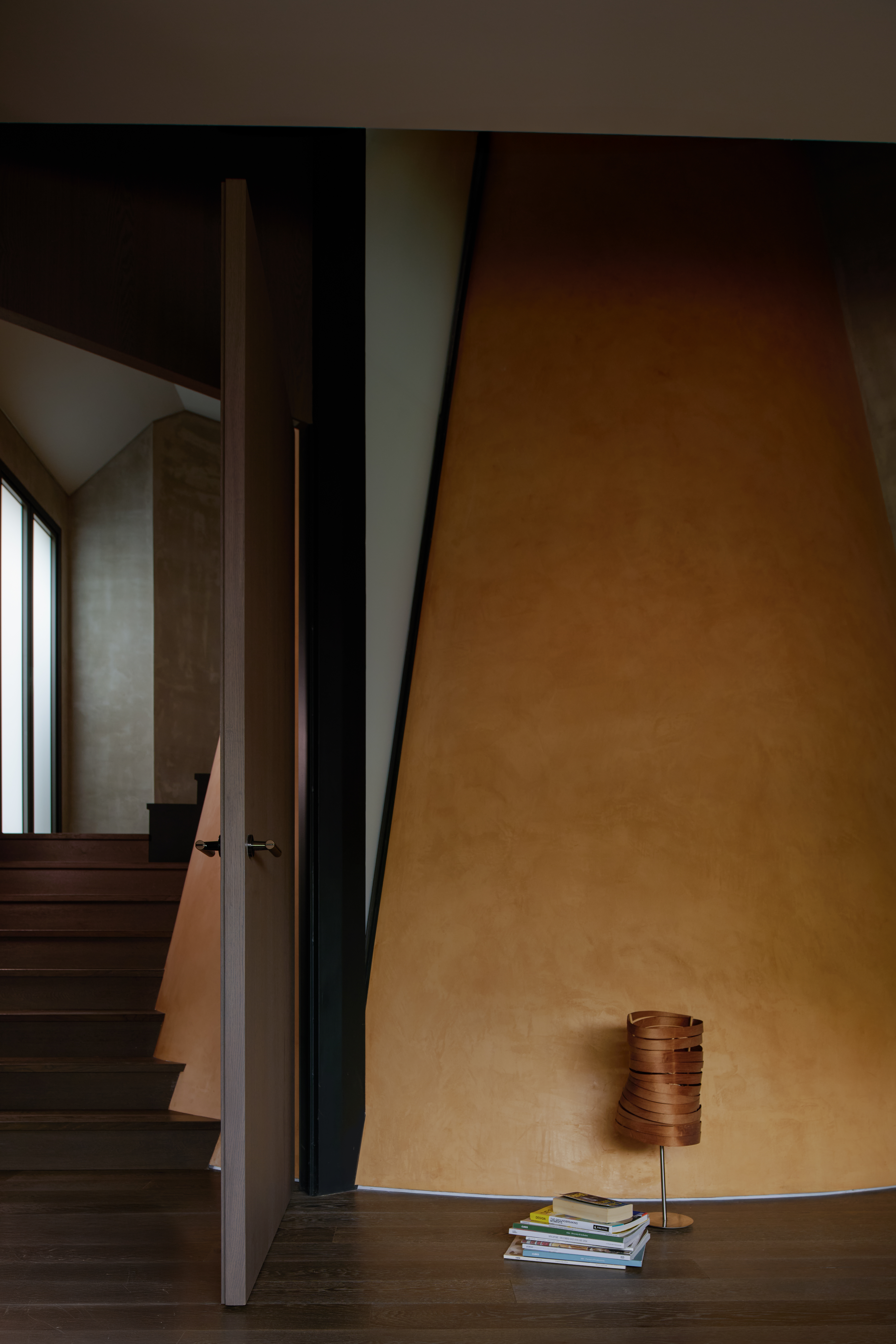 3d-printed concrete house with curved yellow wall in singapore