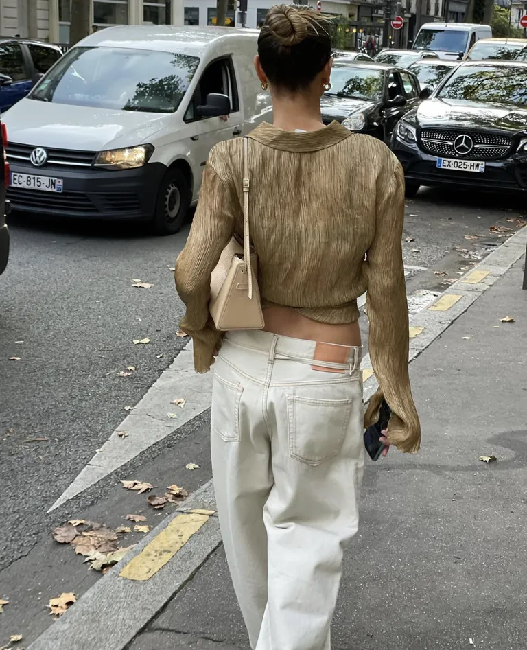 French woman wearing white jeans.