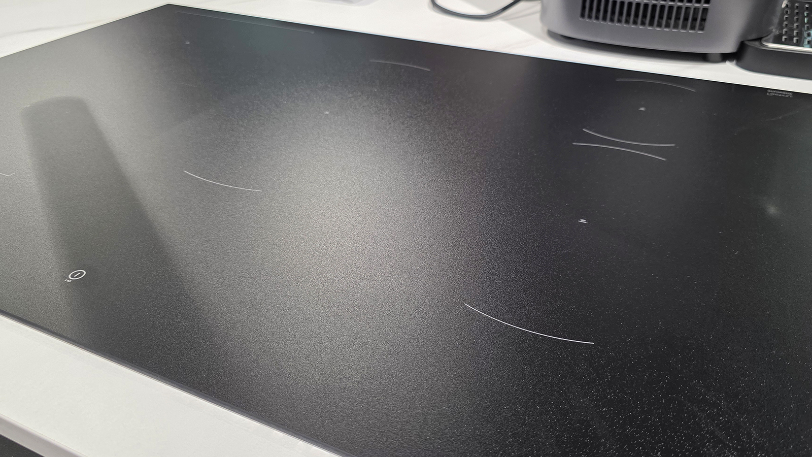A black induction cooktop from Hisense on a kitchen countertop